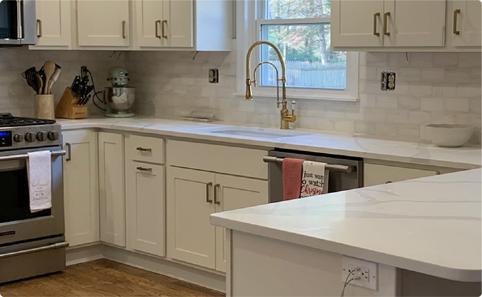 white cabinets in a kitchen with a hardwood floor